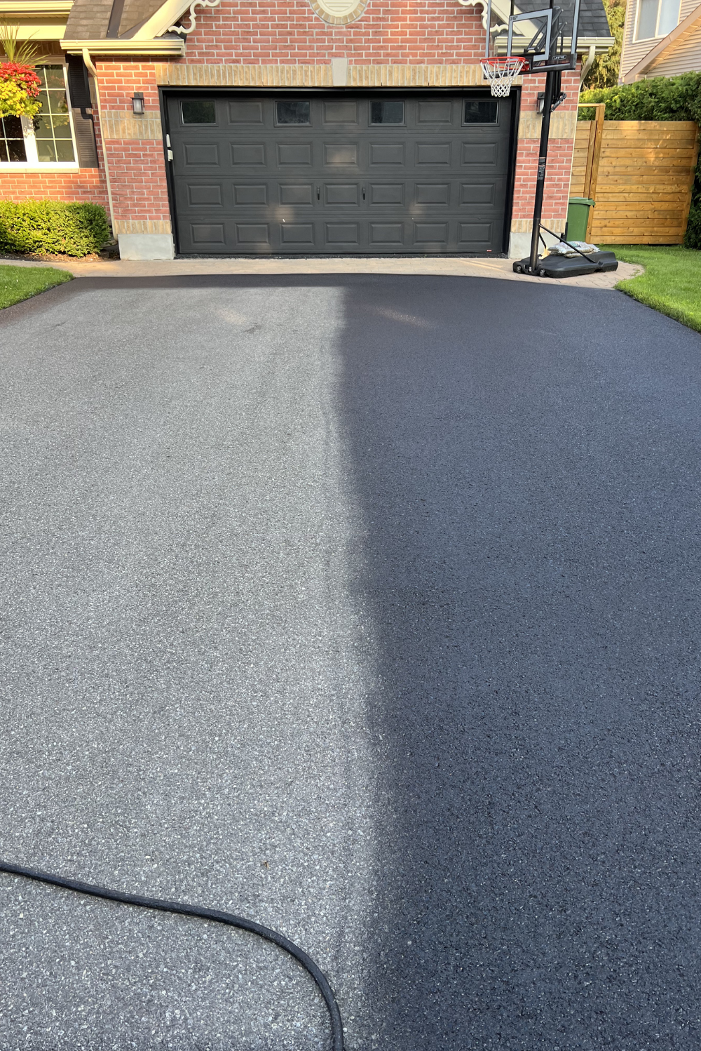 Freshly sealed asphalt driveway