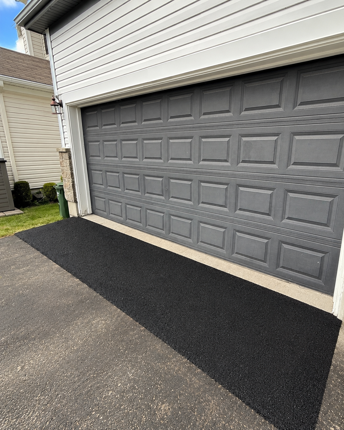 Custom asphalt garage ramp completed by Aura Pave