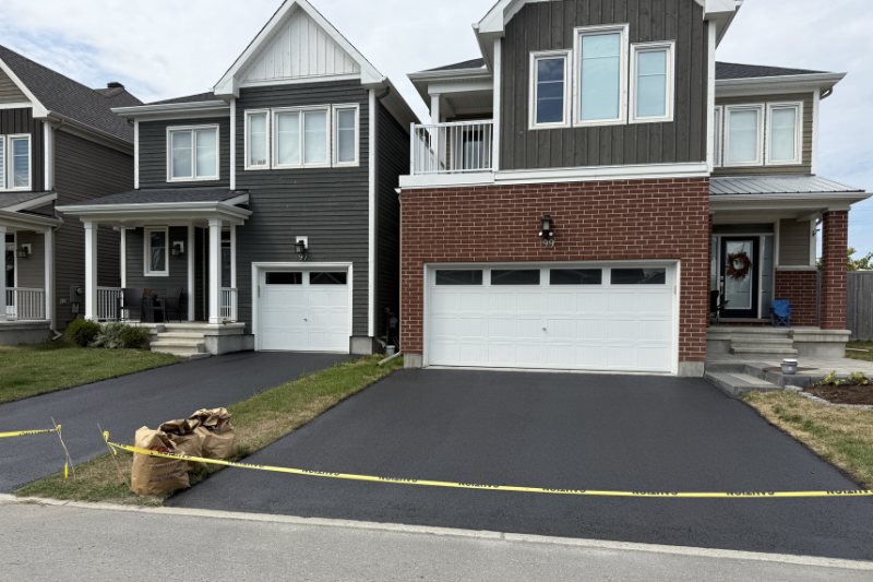 Freshly sealed driveway by Aura Pave